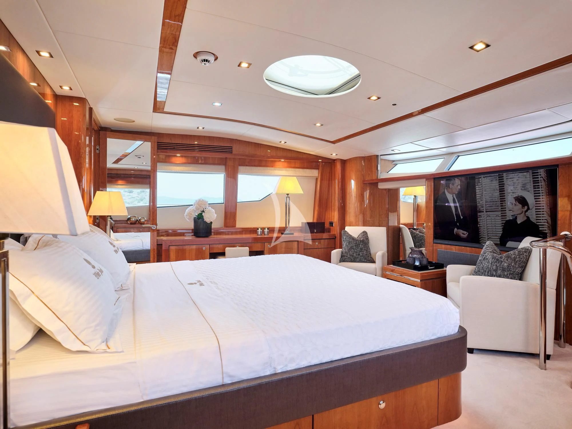 a bedroom with a large bed aboard WHITE PEARL I Yacht for Sale