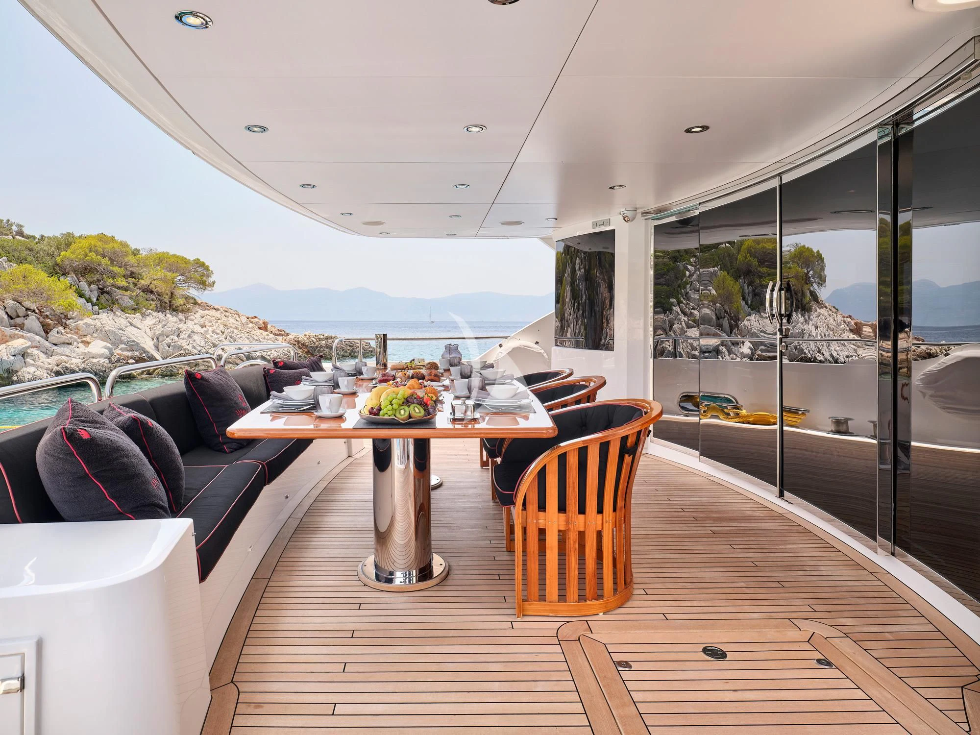 a glass table in a living room aboard WHITE PEARL I Yacht for Sale
