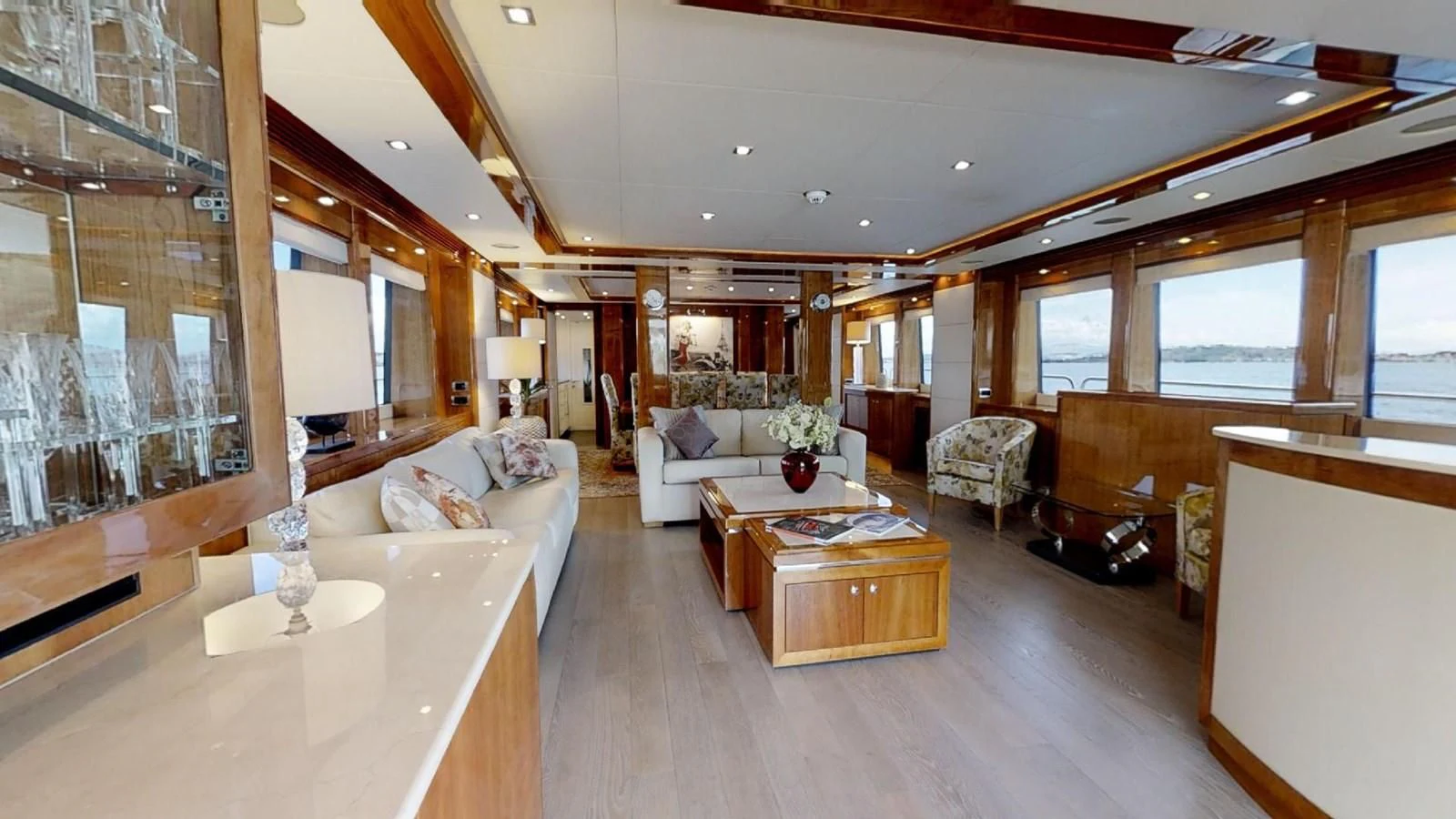 a living room with a large window aboard WHITE PEARL I Yacht for Sale