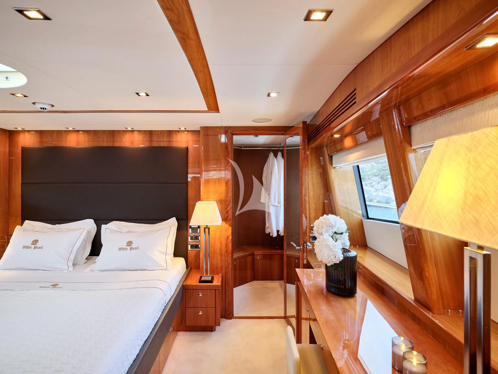a bedroom with a bed and a desk aboard WHITE PEARL I Yacht for Sale