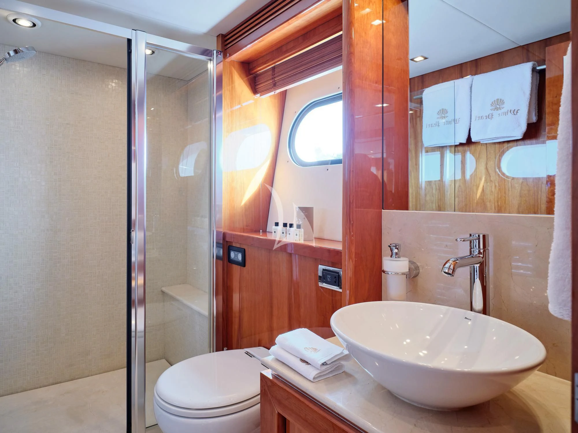 a bathroom with a sink and a toilet aboard WHITE PEARL I Yacht for Sale