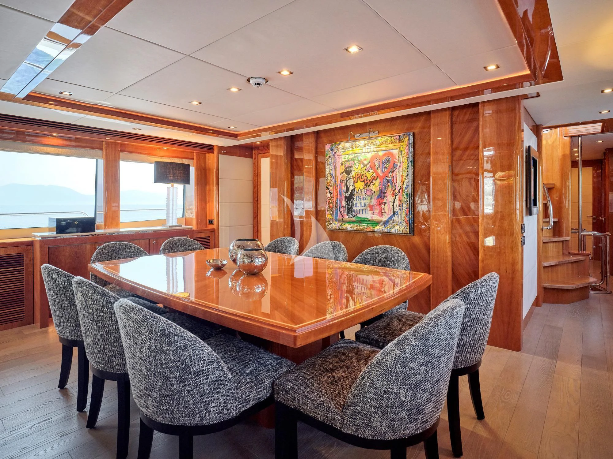 a dining room with a table and chairs aboard WHITE PEARL I Yacht for Sale