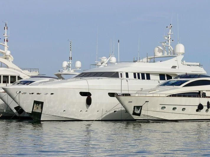 a few white yachts in the water aboard HAPPY LIFE Yacht for Sale