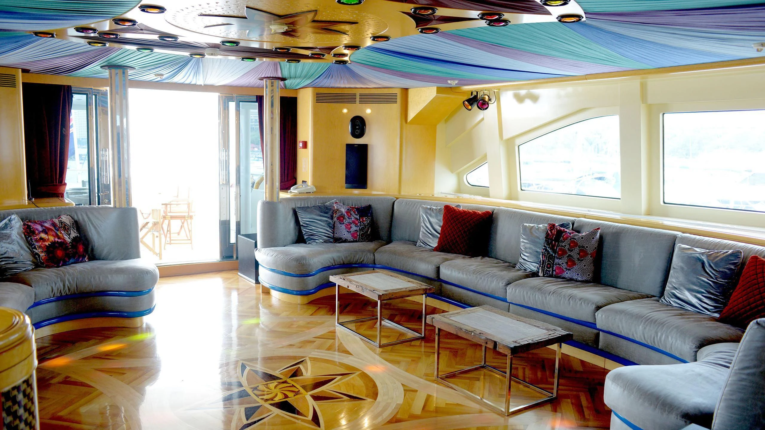 a living room with a couch and a table aboard HAPPY LIFE Yacht for Sale