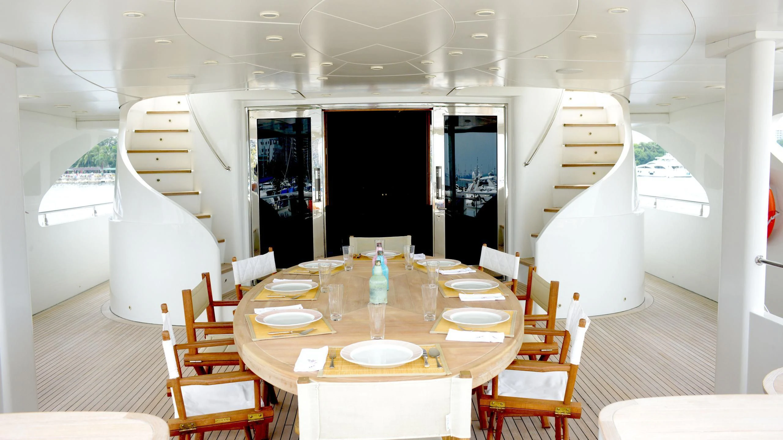 a dining room with a table and chairs aboard HAPPY LIFE Yacht for Sale
