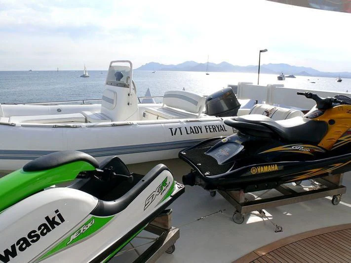 a boat with a motor attached to it aboard HAPPY LIFE Yacht for Sale