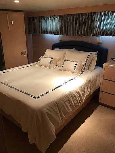 a bed with white sheets aboard LADY GRAY Yacht for Sale