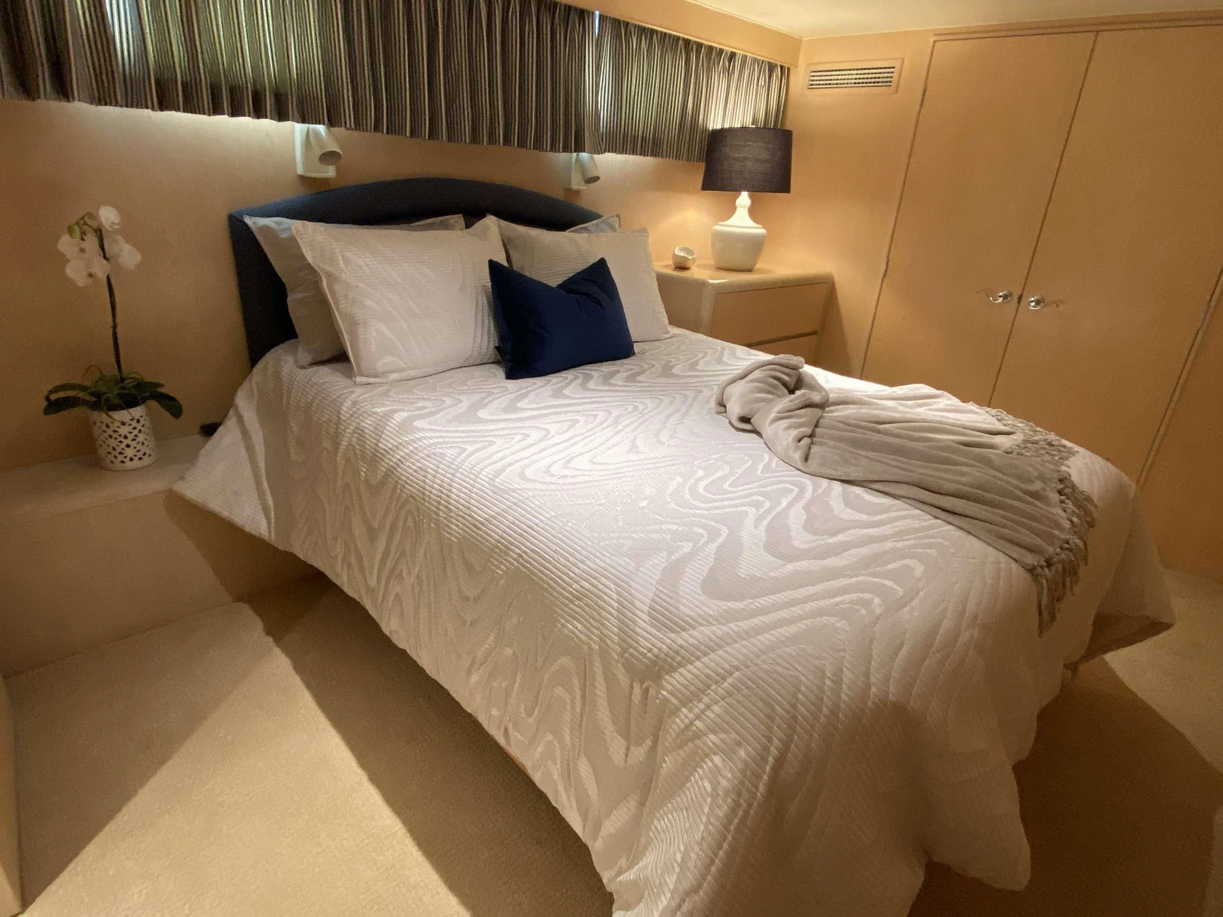 a bed with white sheets aboard LADY GRAY Yacht for Sale