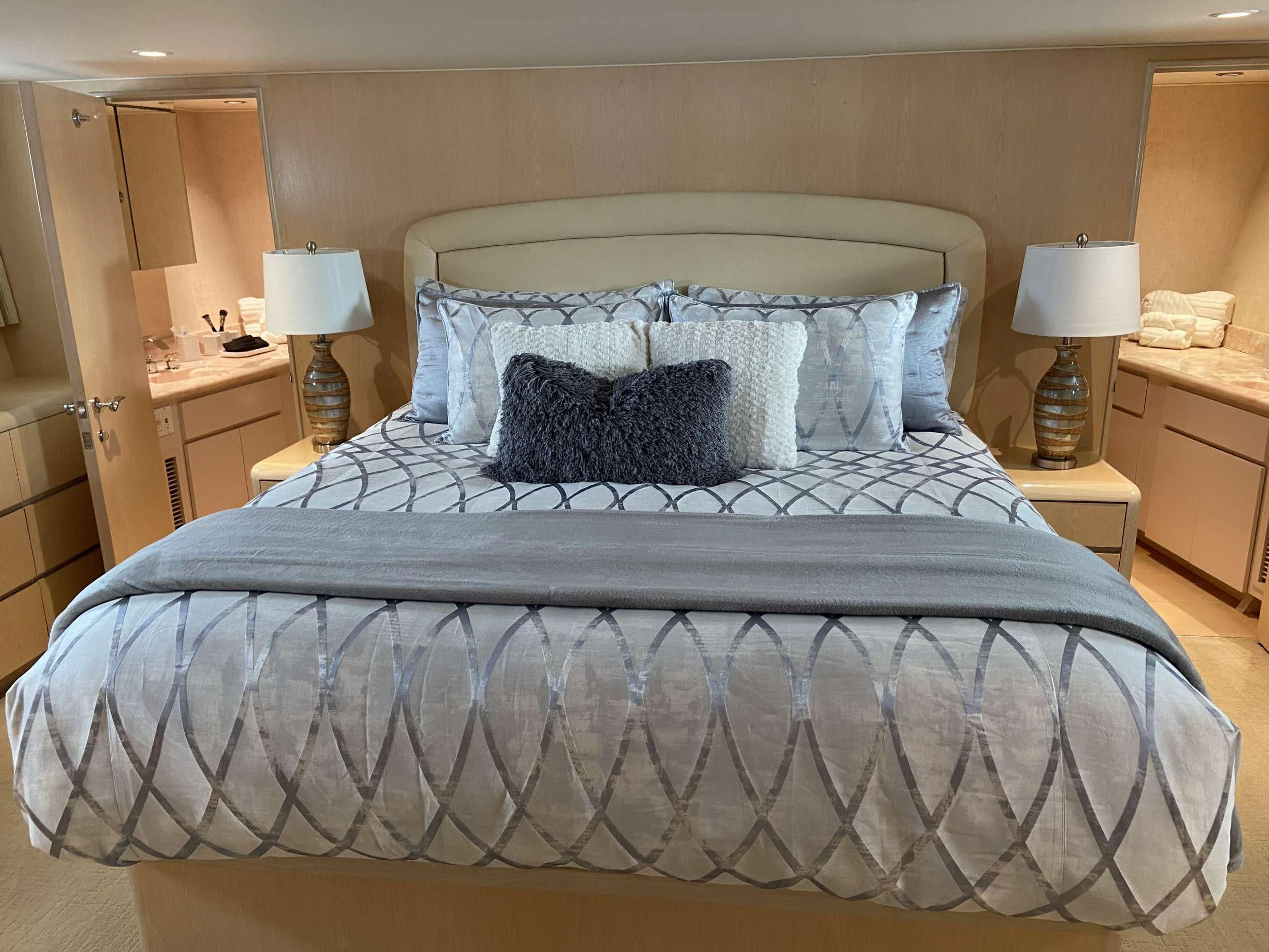a bed with blue sheets aboard LADY GRAY Yacht for Sale