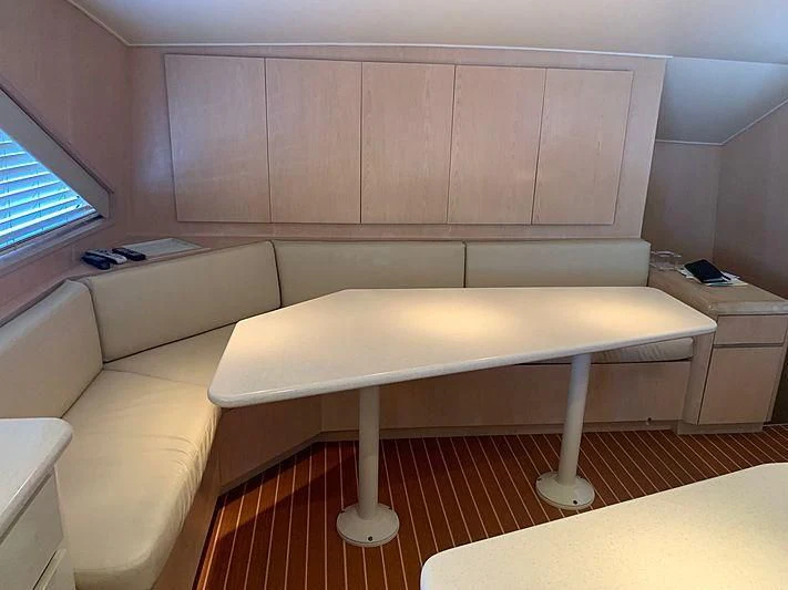 a room with a couch and a table aboard LADY GRAY Yacht for Sale