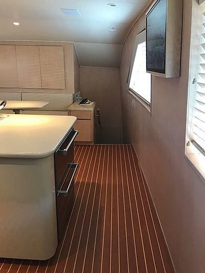 a kitchen with a red rug aboard LADY GRAY Yacht for Sale