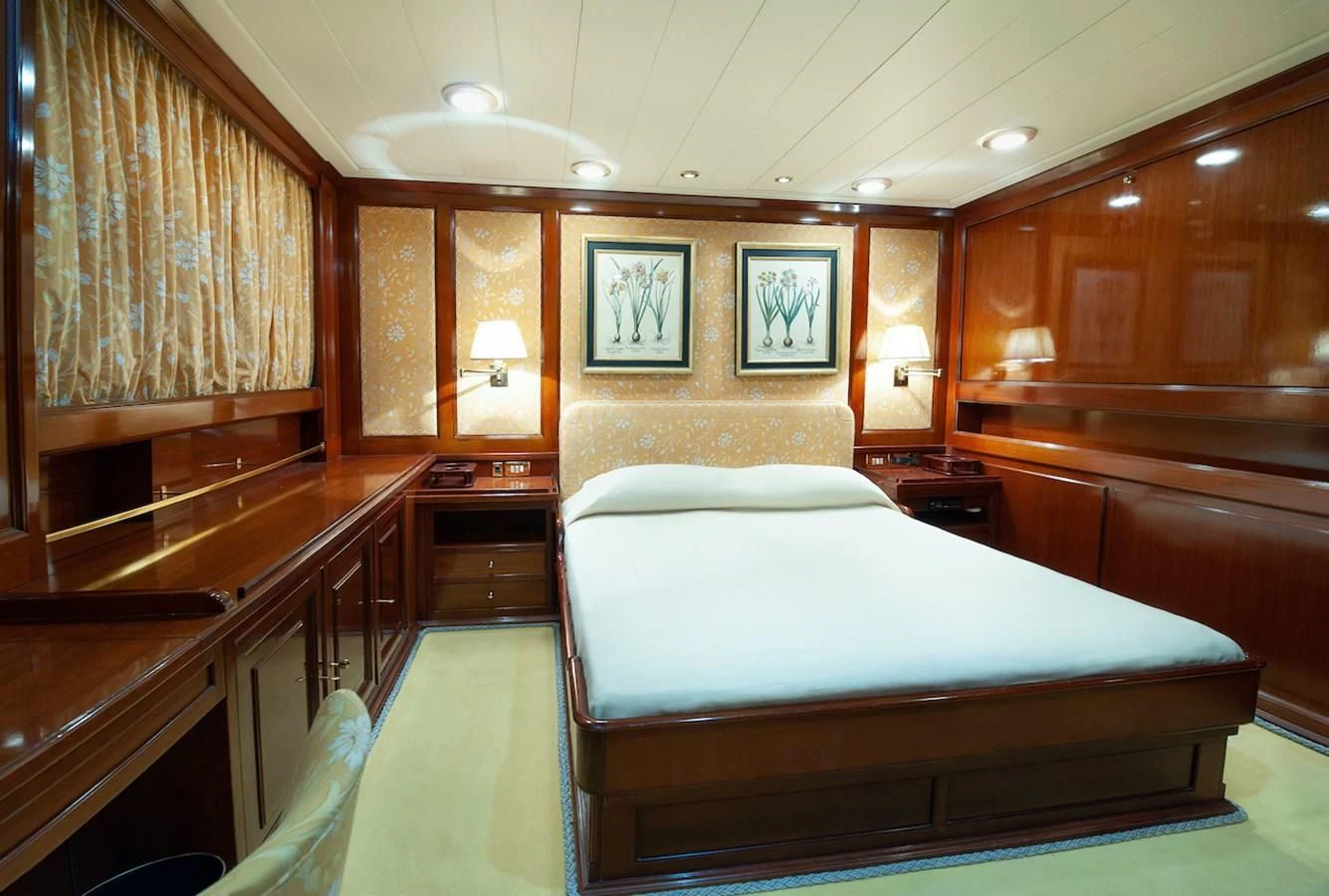 a room with a couple of beds aboard BELLE BRISE Yacht for Sale