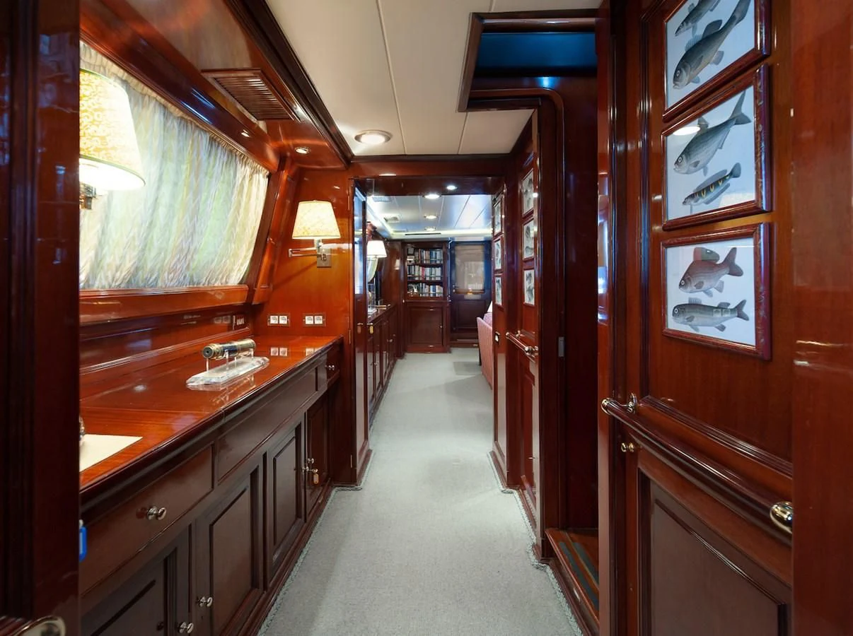 a hallway with wood cabinets aboard BELLE BRISE Yacht for Sale