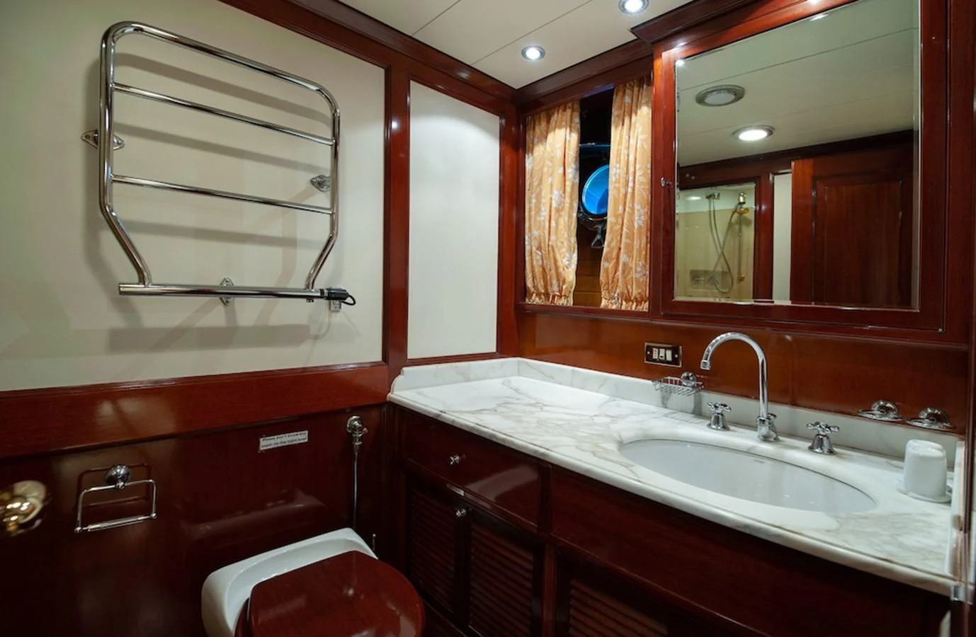 a bathroom with a sink and mirror aboard BELLE BRISE Yacht for Sale