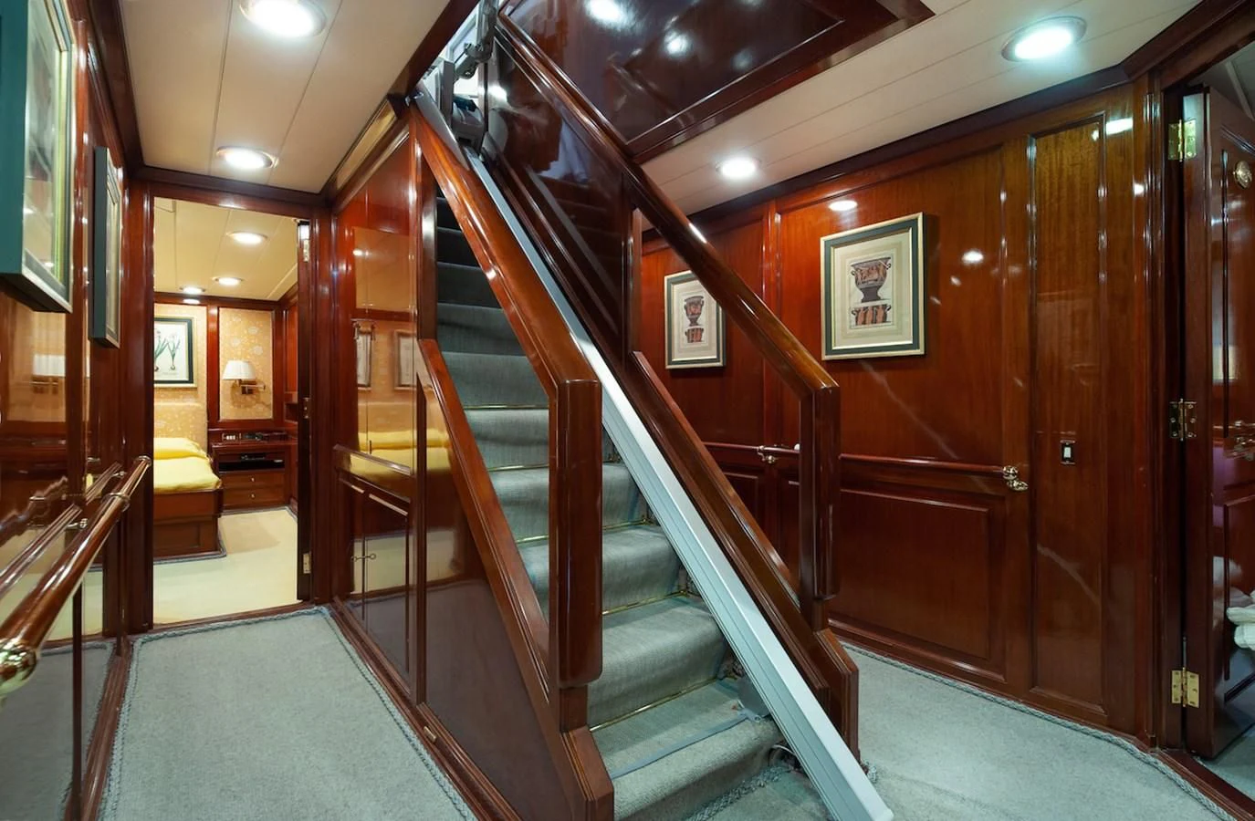a long wood staircase in a building aboard BELLE BRISE Yacht for Sale