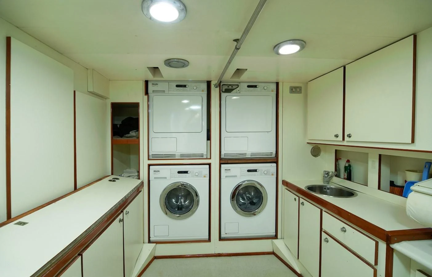 a washer and dryer in a kitchen aboard BELLE BRISE Yacht for Sale
