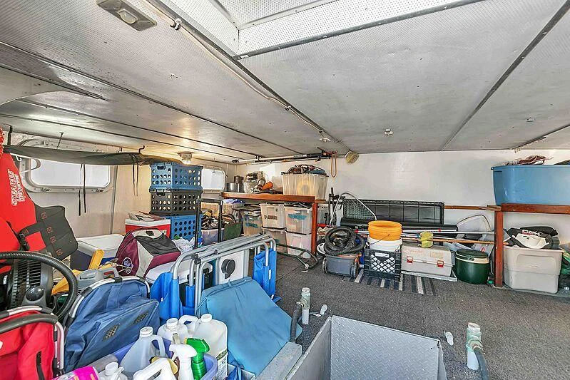 a room with a lot of luggage aboard LA VIDA Yacht for Sale