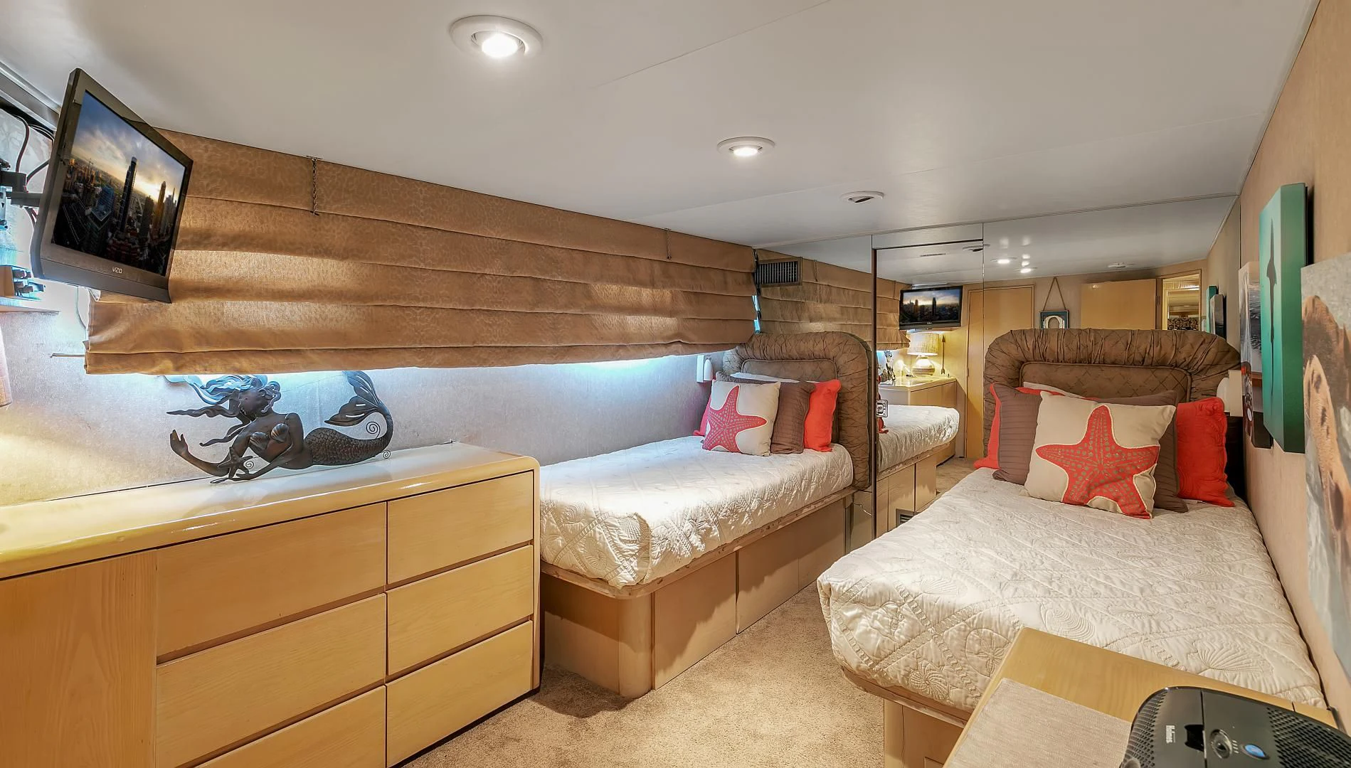 a bedroom with a couple of beds aboard LA VIDA Yacht for Sale