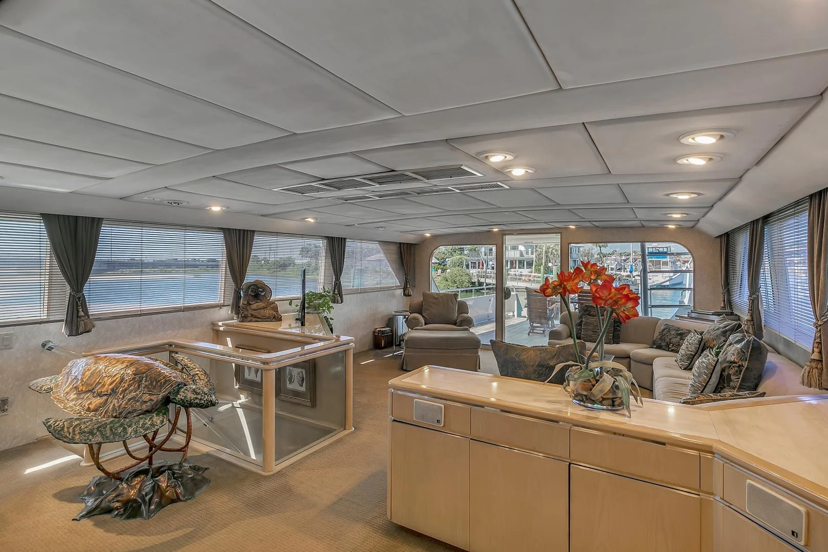 a living room with a large window aboard LA VIDA Yacht for Sale