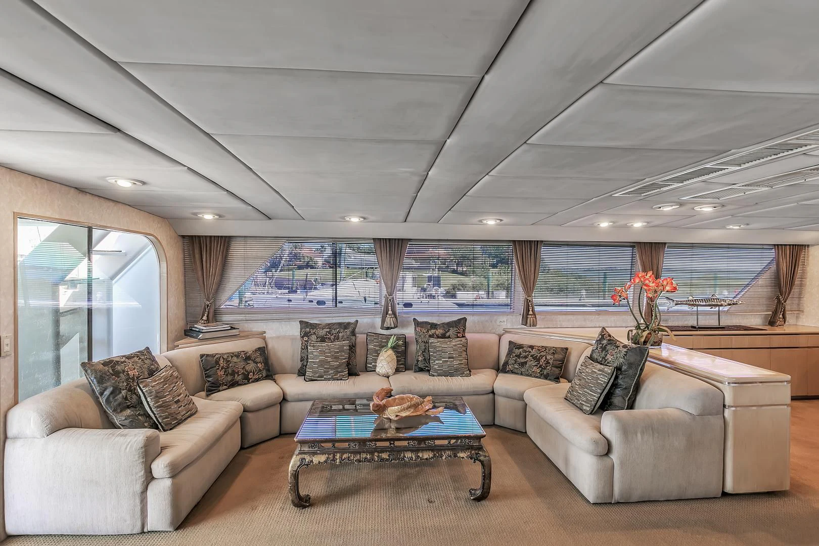 a living room with a couch and a table aboard LA VIDA Yacht for Sale