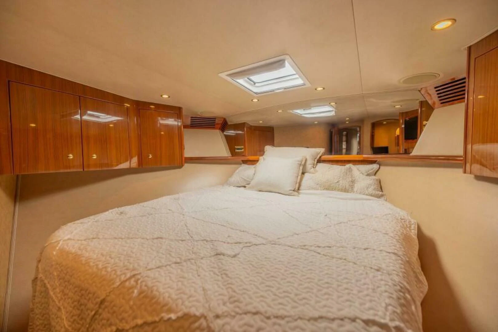 a large bed in a room aboard DON'T STOP BELIEVIN Yacht for Sale
