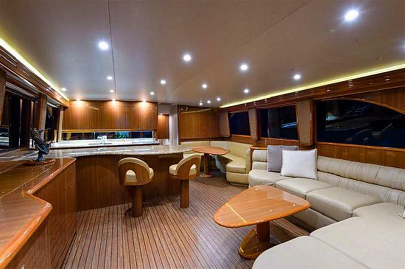 a large living room with a large kitchen and dining area aboard DON'T STOP BELIEVIN Yacht for Sale