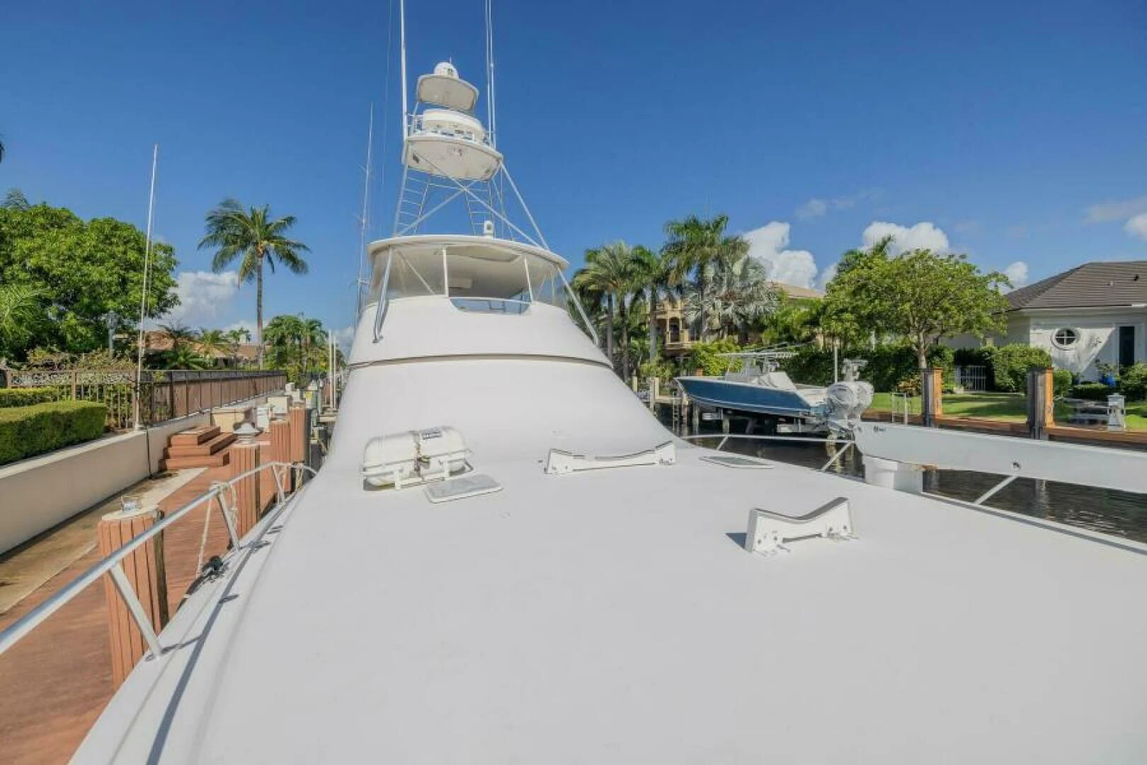 a white boat on a dock aboard DON'T STOP BELIEVIN Yacht for Sale
