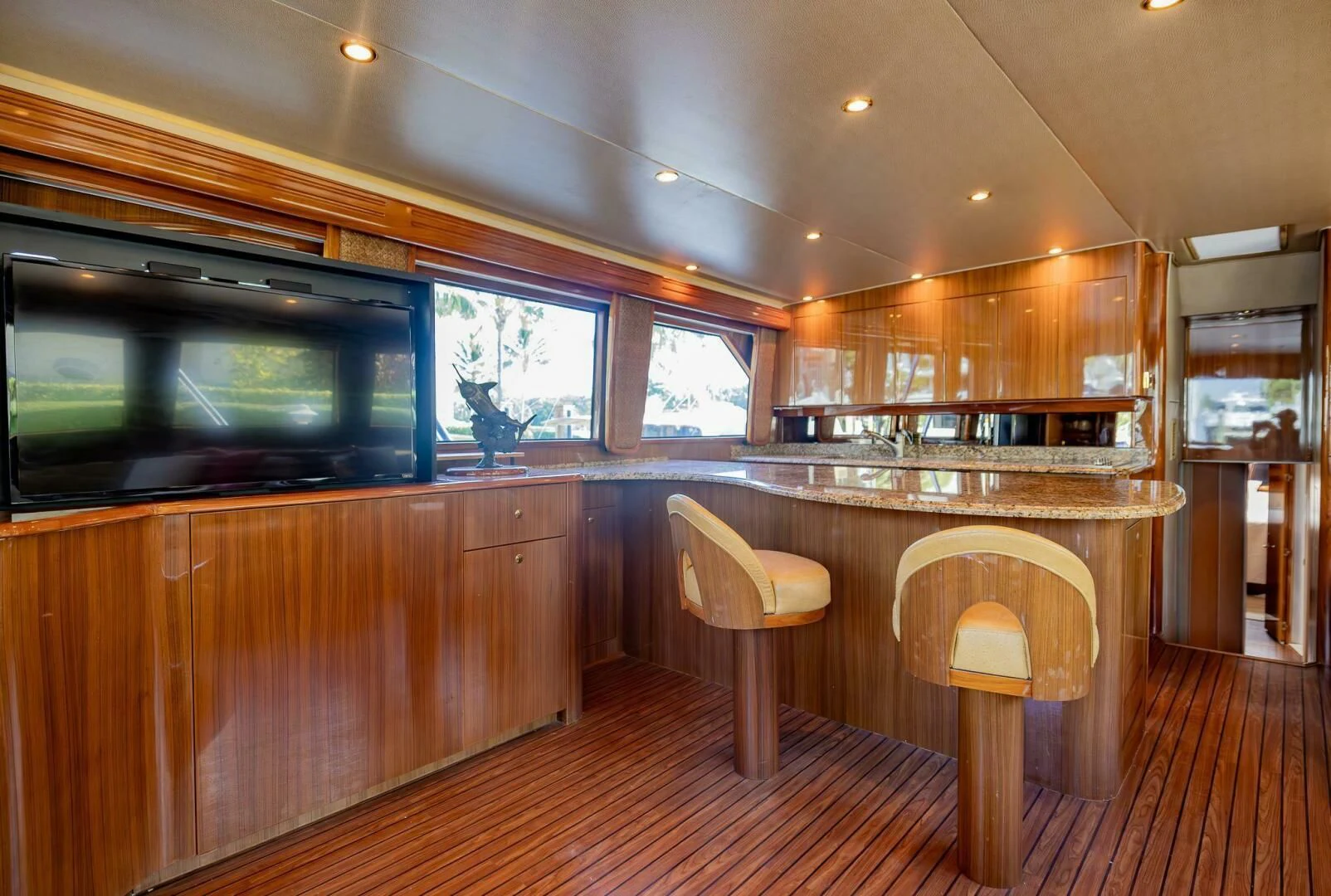 a kitchen with wooden cabinets aboard DON'T STOP BELIEVIN Yacht for Sale