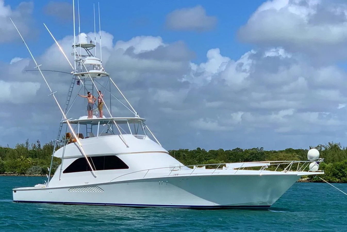 a couple of people on a boat aboard DON'T STOP BELIEVIN Yacht for Sale