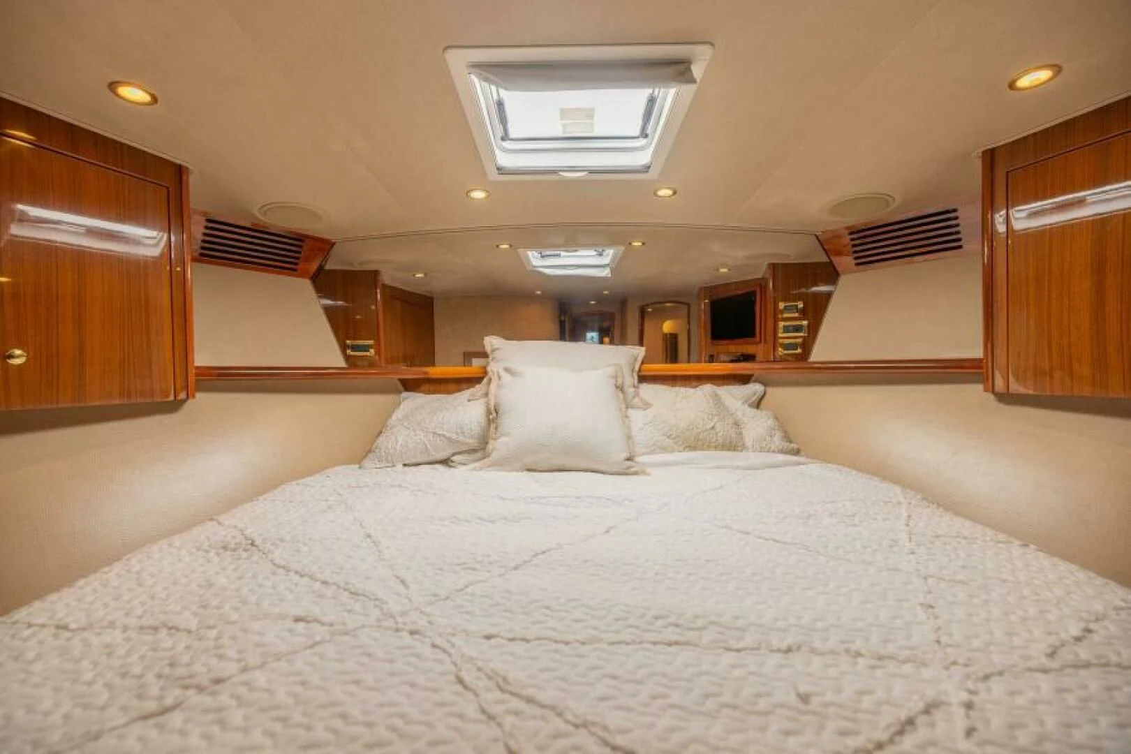 a bed with white sheets aboard DON'T STOP BELIEVIN Yacht for Sale
