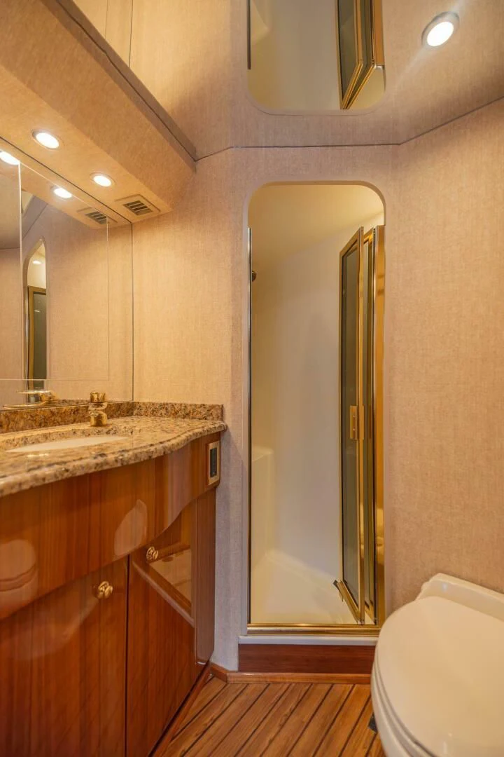 a bathroom with a glass shower door aboard DON'T STOP BELIEVIN Yacht for Sale