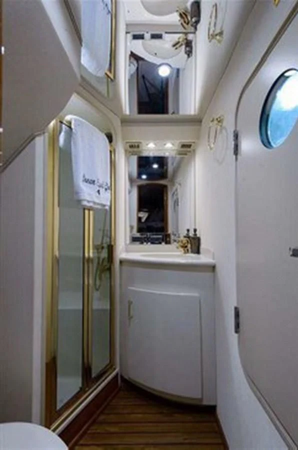 a bathroom with a shower and sink aboard DON'T STOP BELIEVIN Yacht for Sale