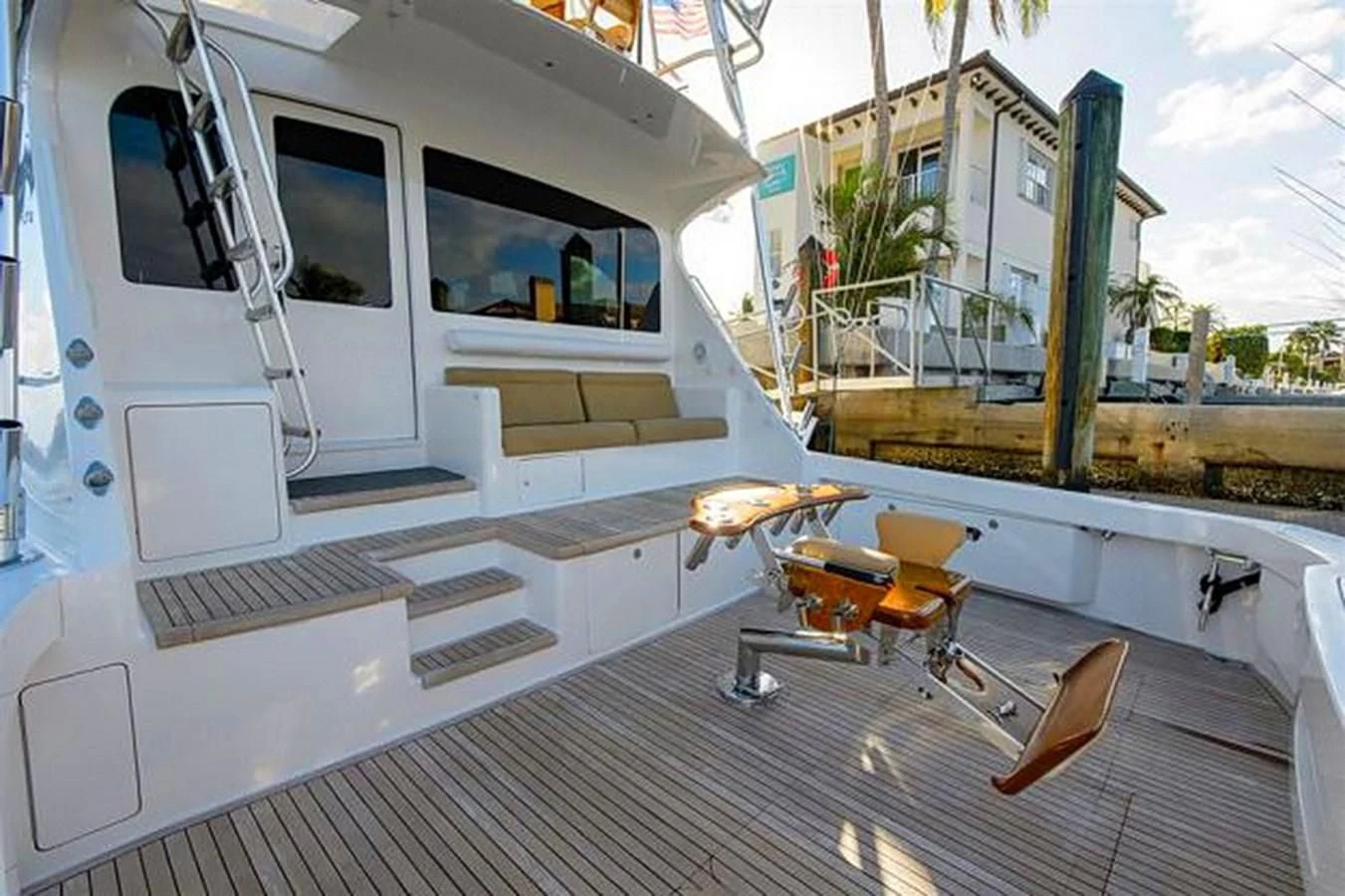 a white boat on a deck aboard DON'T STOP BELIEVIN Yacht for Sale