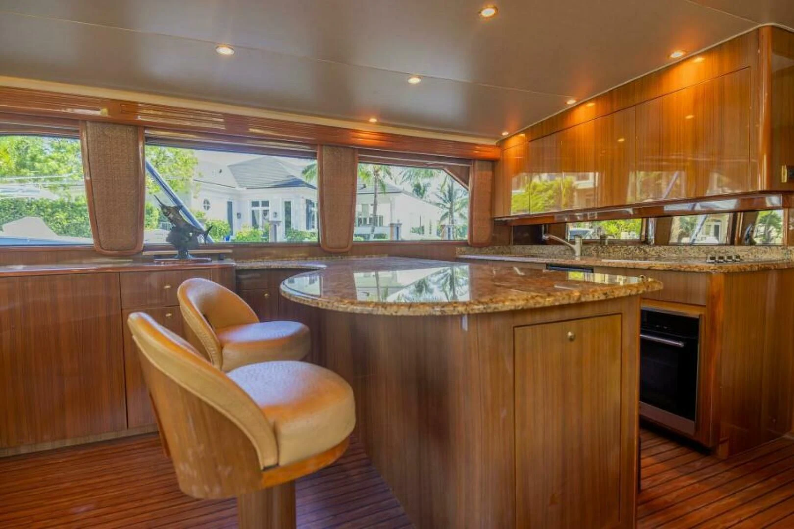 a kitchen with wooden cabinets aboard DON'T STOP BELIEVIN Yacht for Sale