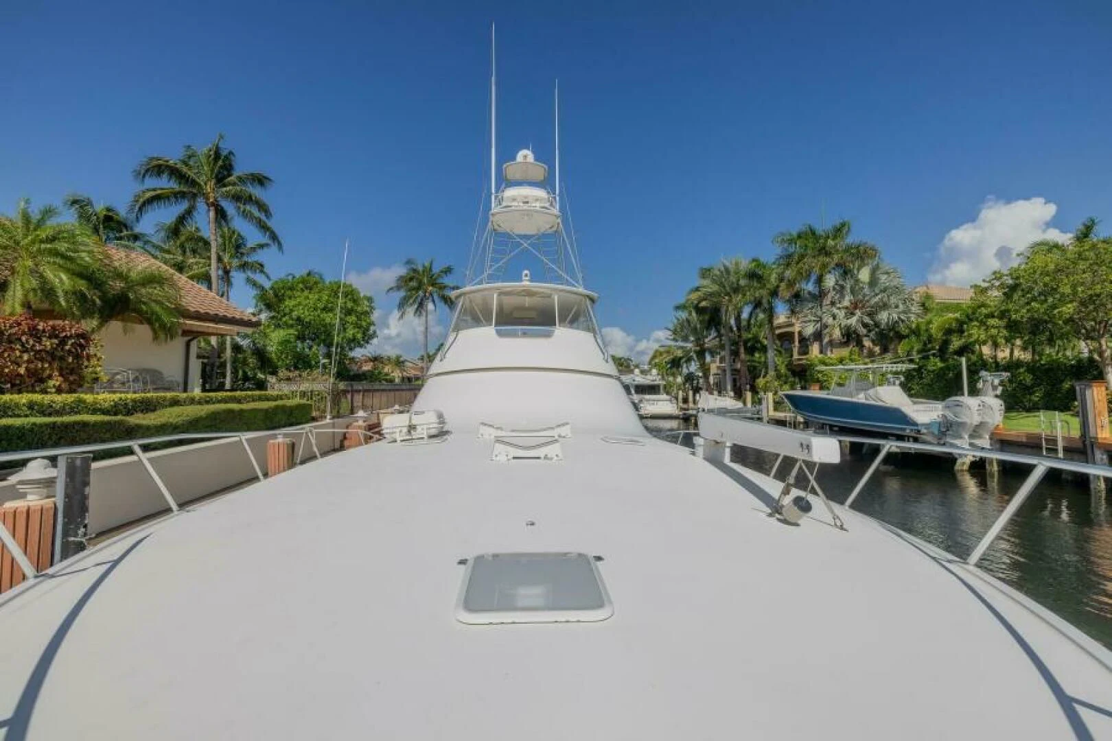 a white boat with a blue tower aboard DON'T STOP BELIEVIN Yacht for Sale