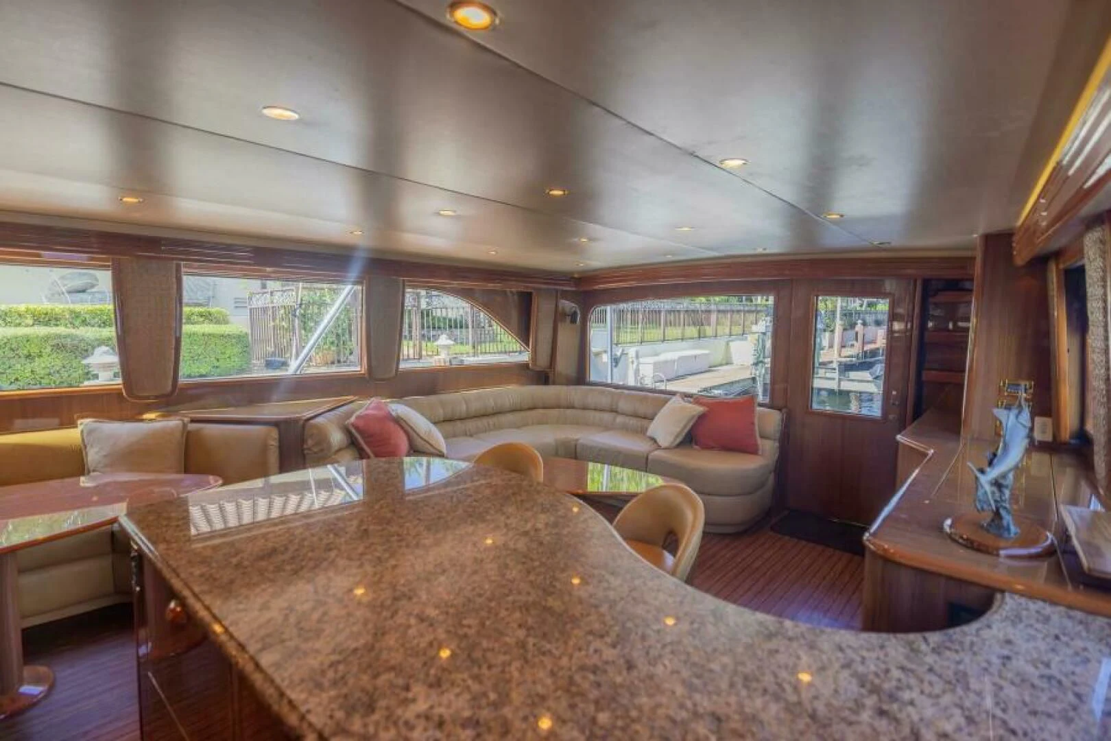 a living room with a large table aboard DON'T STOP BELIEVIN Yacht for Sale