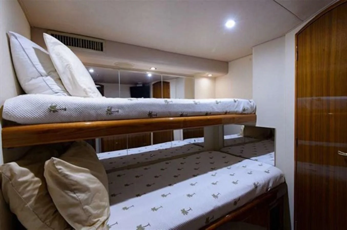 a bed with white sheets aboard DON'T STOP BELIEVIN Yacht for Sale