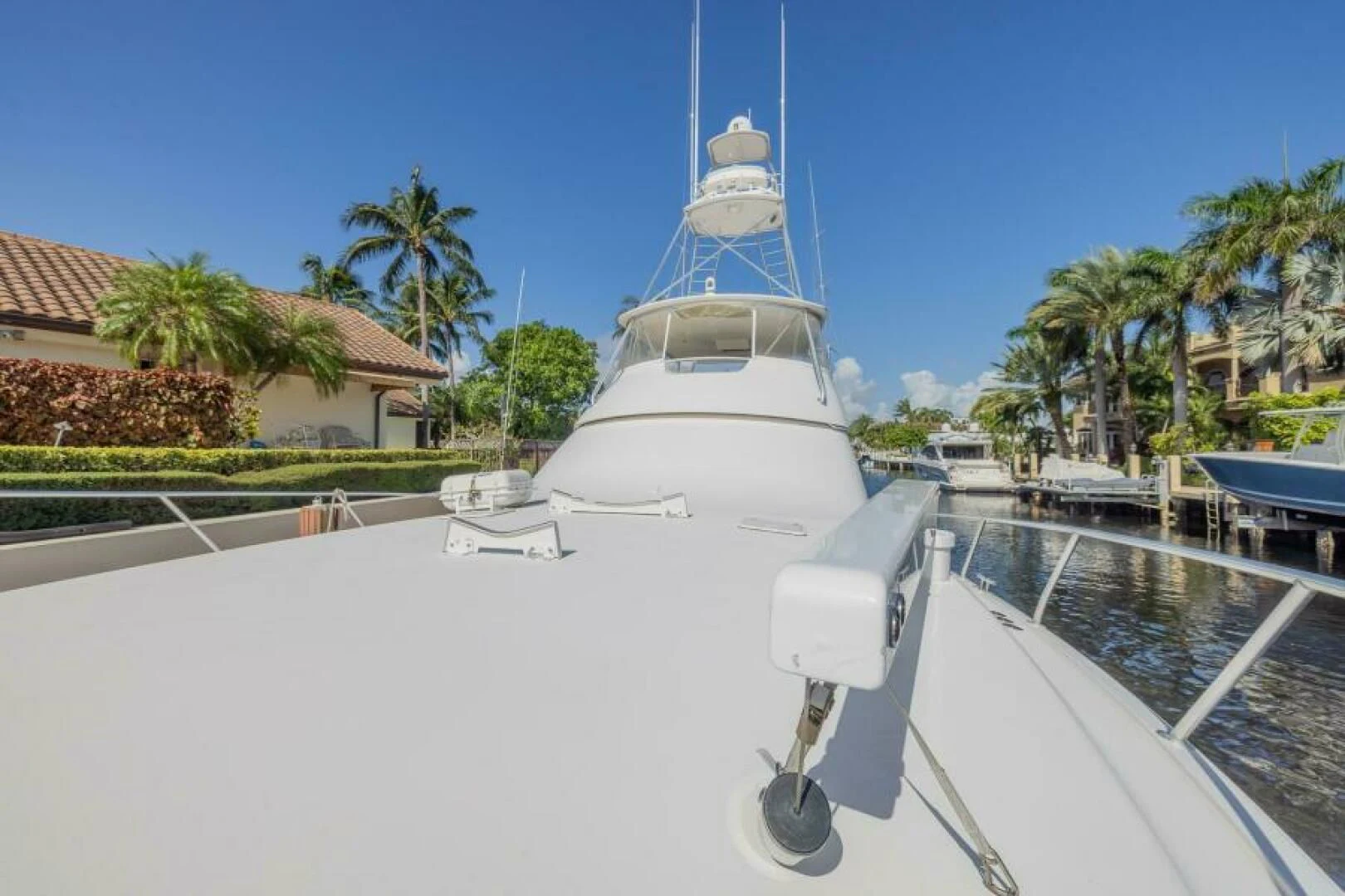 a white boat in a tropical area aboard DON'T STOP BELIEVIN Yacht for Sale