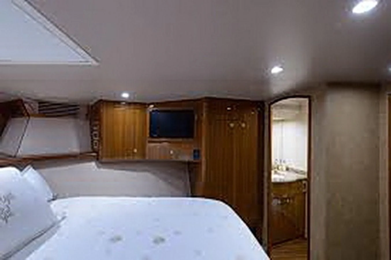 a bedroom with a large bed aboard DON'T STOP BELIEVIN Yacht for Sale