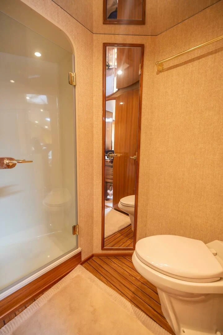 a bathroom with a glass shower door aboard DON'T STOP BELIEVIN Yacht for Sale
