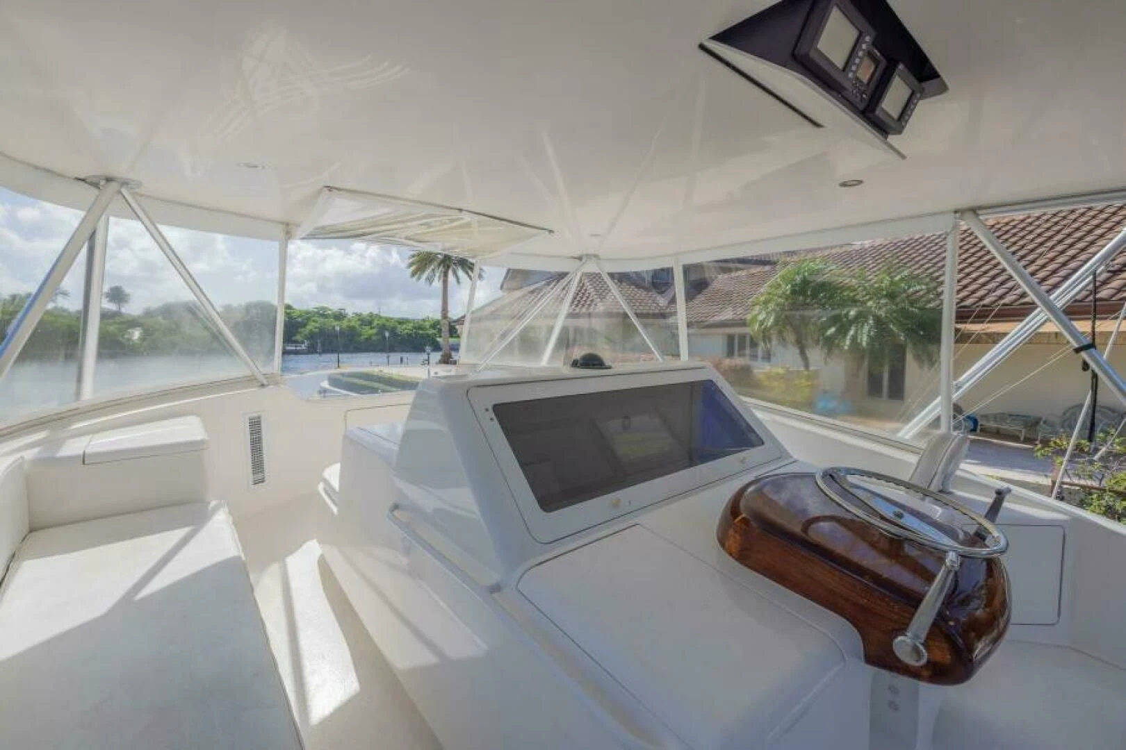 a white tent with a laptop and a watch on it aboard DON'T STOP BELIEVIN Yacht for Sale