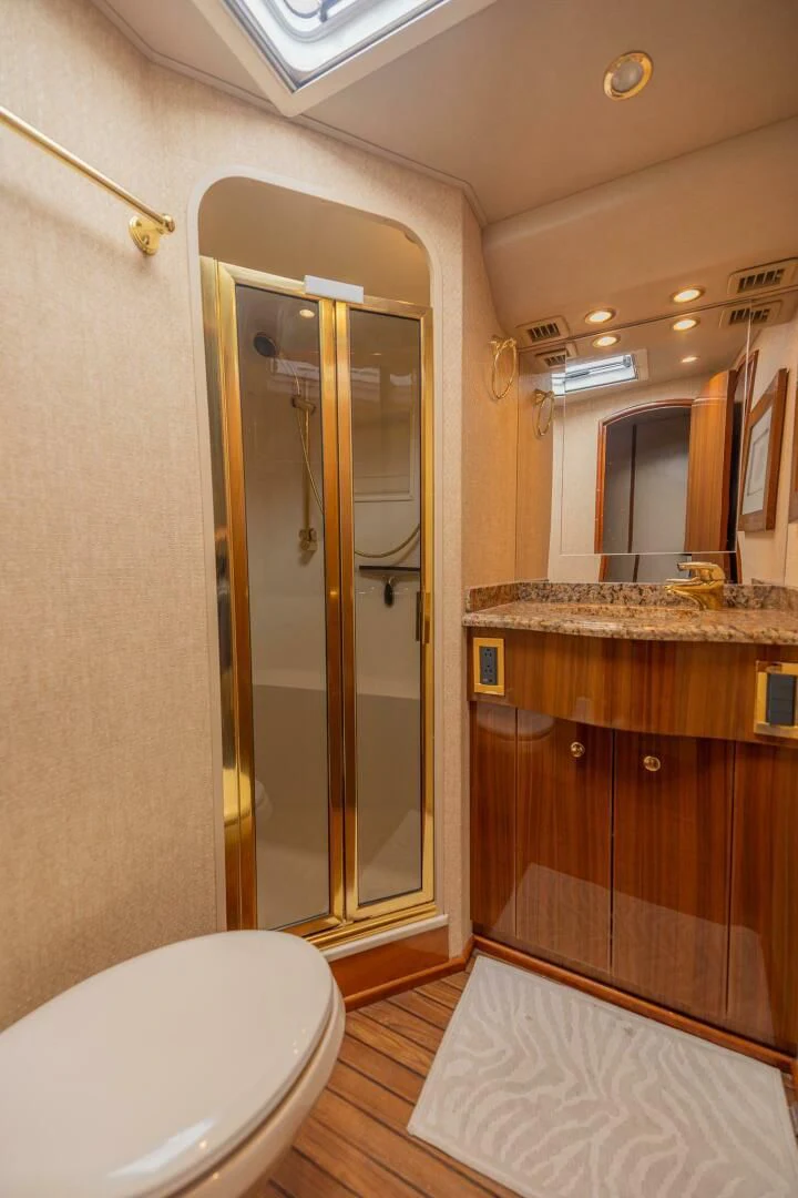a bathroom with a glass shower aboard DON'T STOP BELIEVIN Yacht for Sale