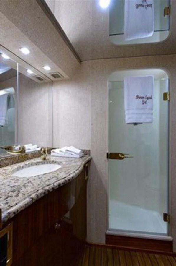 a bathroom with a sink and a mirror aboard DON'T STOP BELIEVIN Yacht for Sale