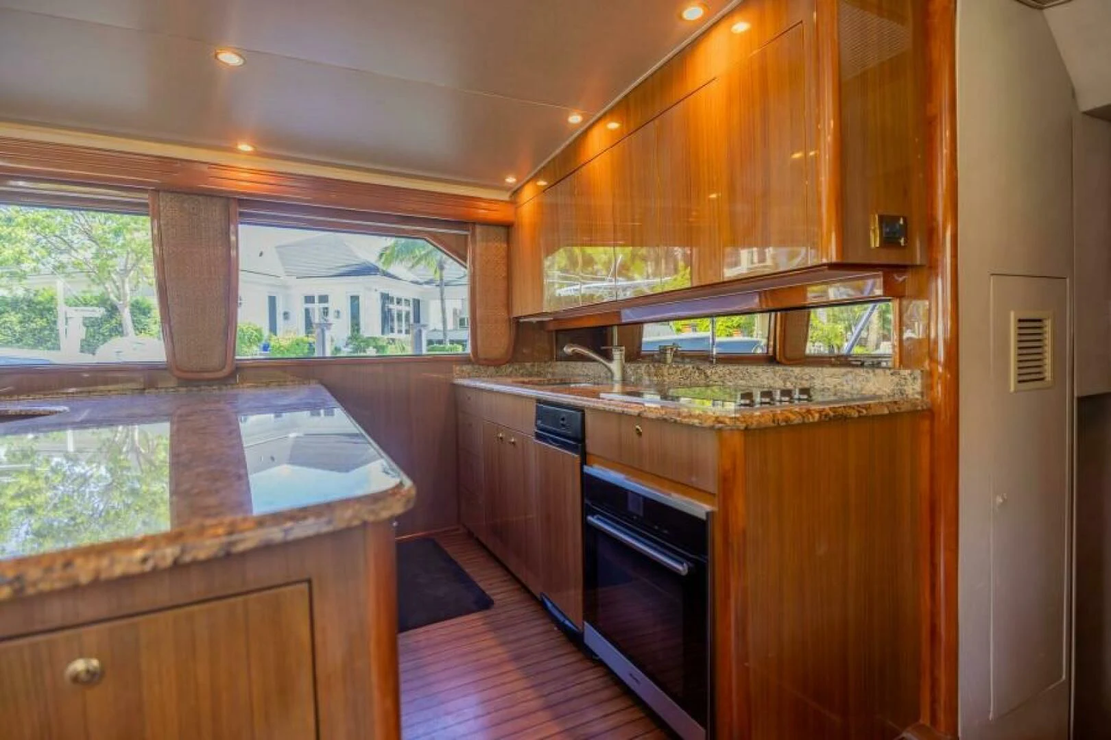a kitchen with wooden cabinets aboard DON'T STOP BELIEVIN Yacht for Sale
