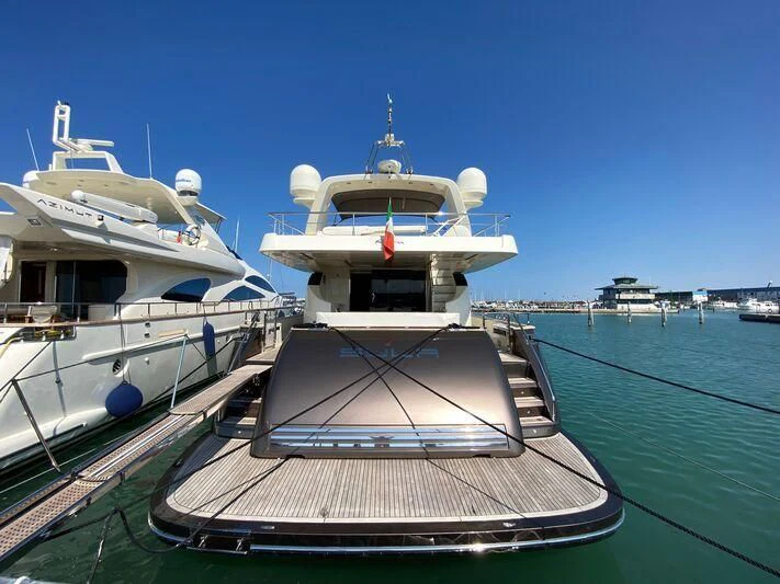 a boat docked at a pier aboard SULA Yacht for Sale