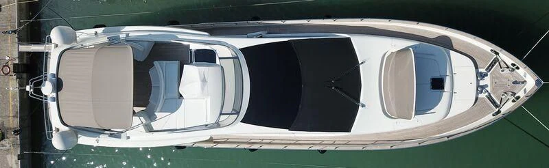 a white car with a black roof aboard SULA Yacht for Sale
