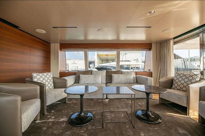 a living room with a large window aboard SK Yacht for Sale