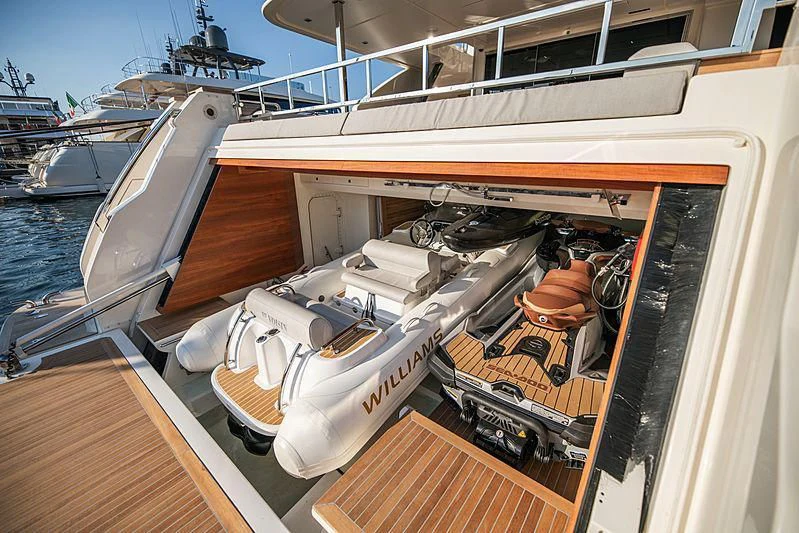 a boat with a large gun aboard SK Yacht for Sale