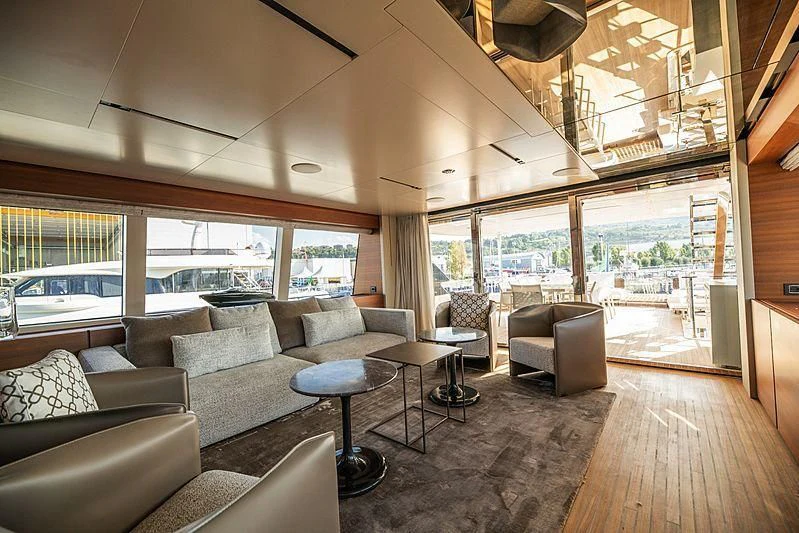 a living room with a large window aboard SK Yacht for Sale