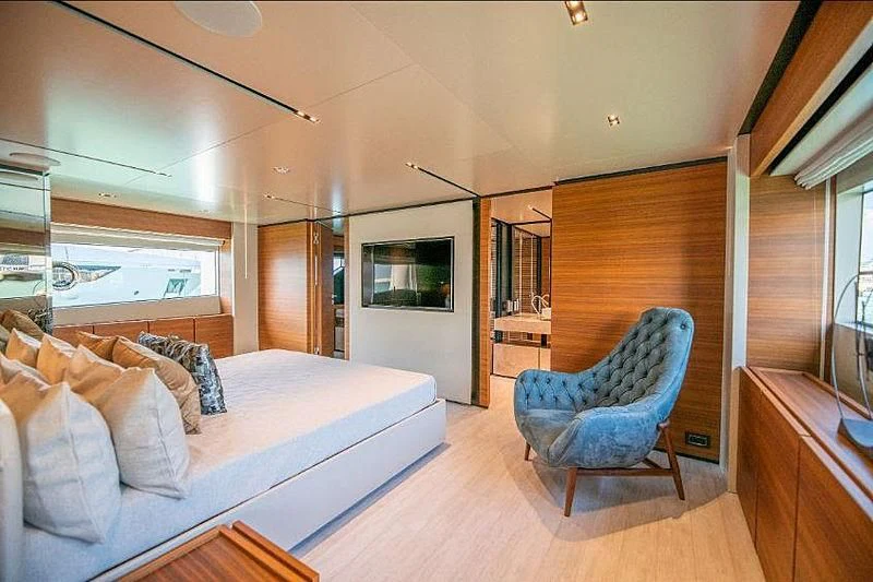 a living room with a couch and a chair aboard SK Yacht for Sale